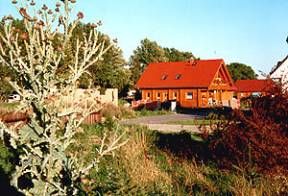 Holzblockhaus mit Kamin direkt am Strand