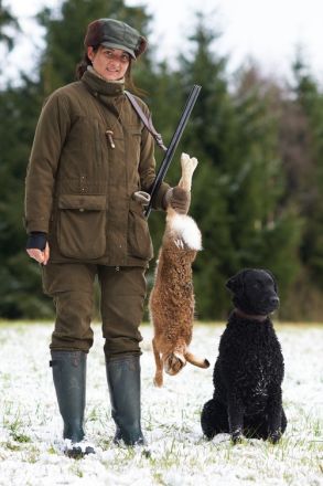 Welpen Curly Coated Retriever-lockig